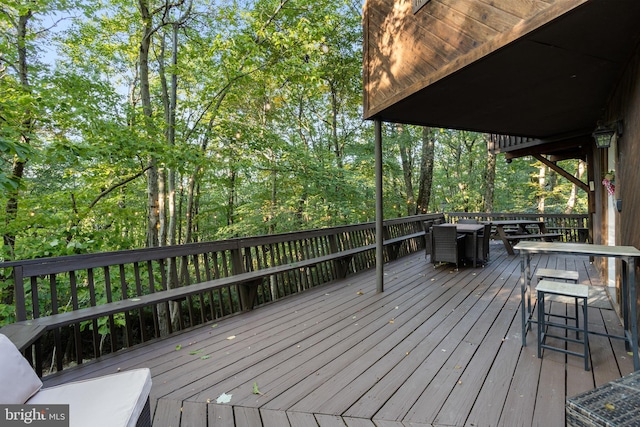 wooden terrace featuring an outdoor bar