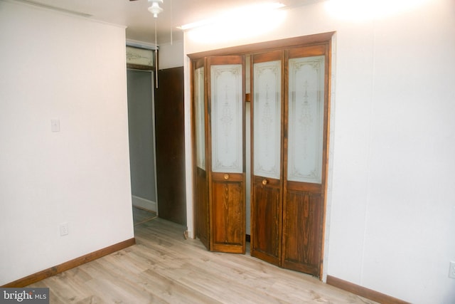 unfurnished bedroom featuring light wood-type flooring