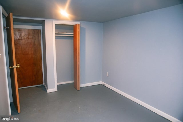 unfurnished bedroom with a closet