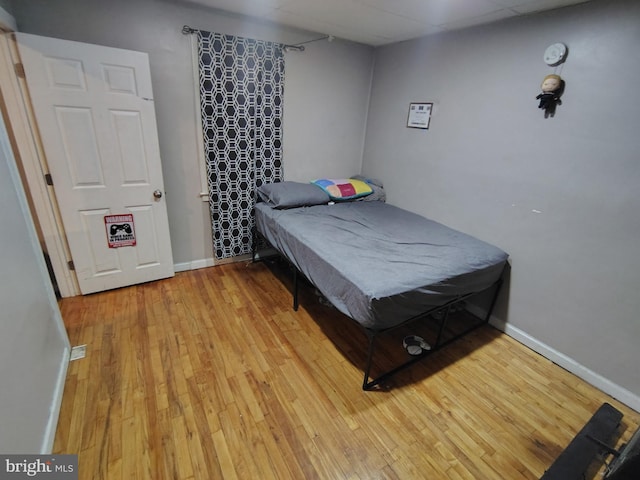 bedroom with light hardwood / wood-style floors