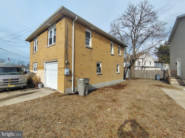 view of side of home with a garage