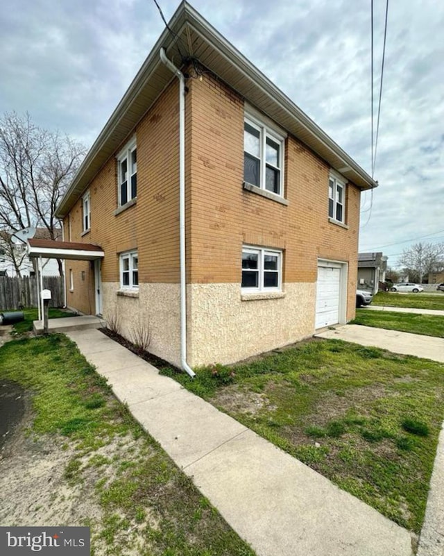 view of side of home featuring a garage