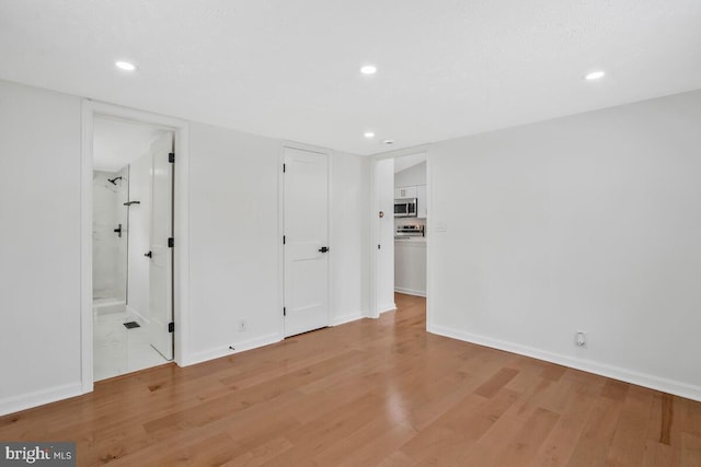 spare room featuring light hardwood / wood-style flooring