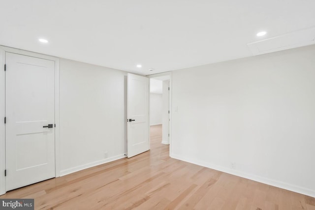 spare room featuring light hardwood / wood-style flooring