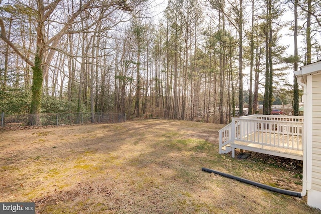 view of yard with a wooden deck