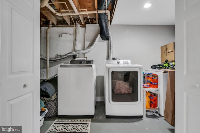 washroom featuring washing machine and dryer