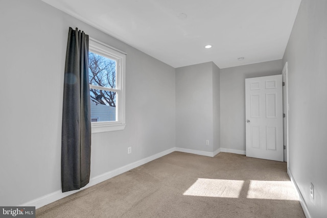 unfurnished bedroom with light colored carpet