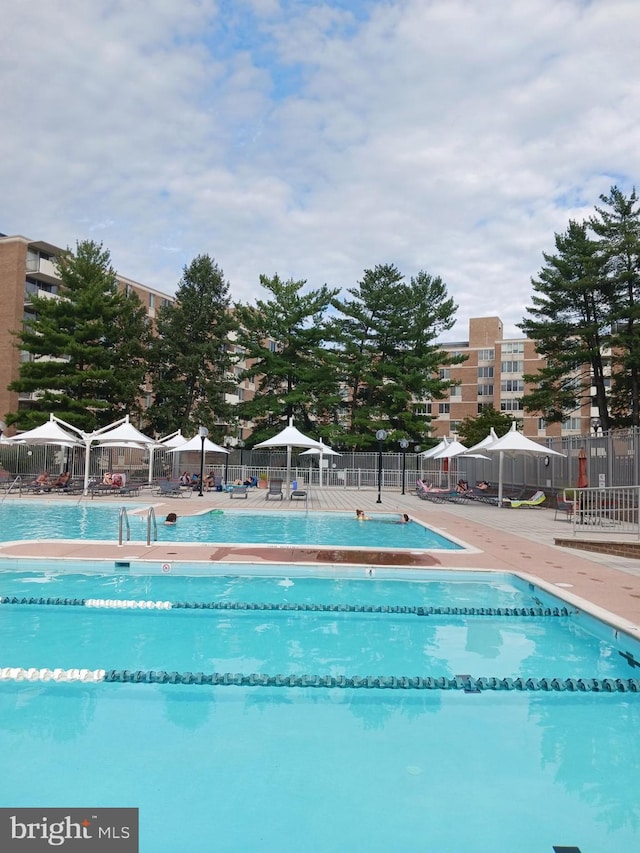 view of pool featuring a gazebo and a patio