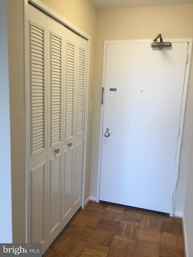 corridor featuring dark parquet floors