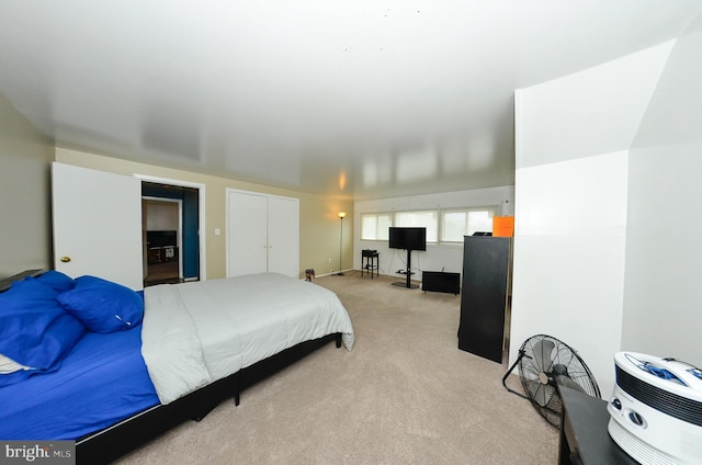 carpeted bedroom with a closet