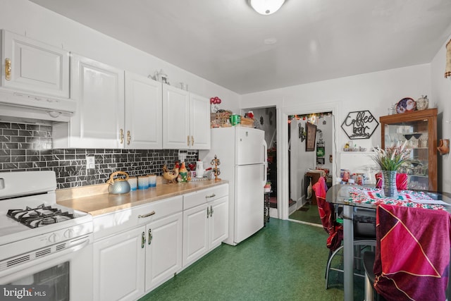 kitchen featuring backsplash, white appliances, and white cabinets