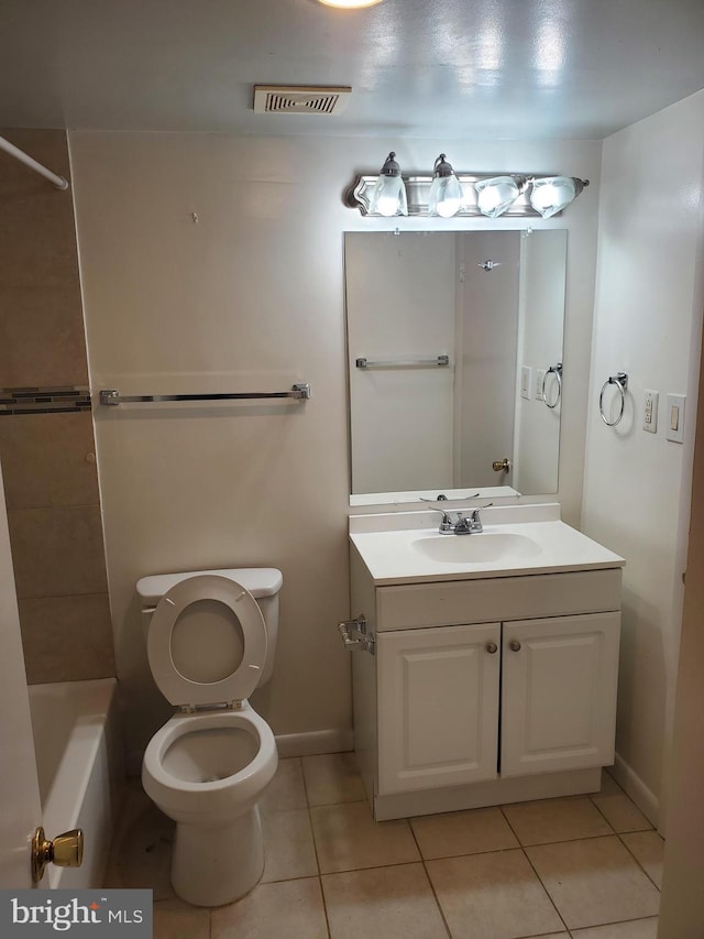 bathroom with tile patterned floors, vanity, and toilet