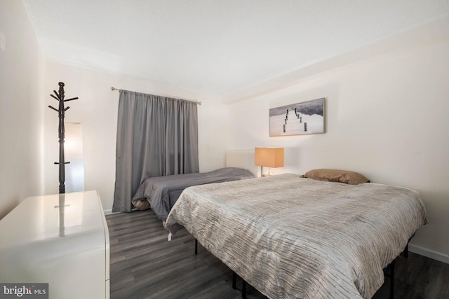 bedroom featuring dark wood-type flooring