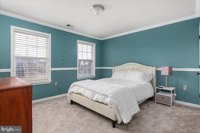 bedroom featuring light carpet, ornamental molding, visible vents, and baseboards