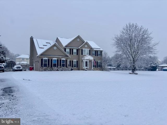 view of front of house featuring a chimney