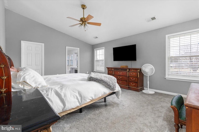 bedroom featuring lofted ceiling, visible vents, carpet flooring, ceiling fan, and baseboards