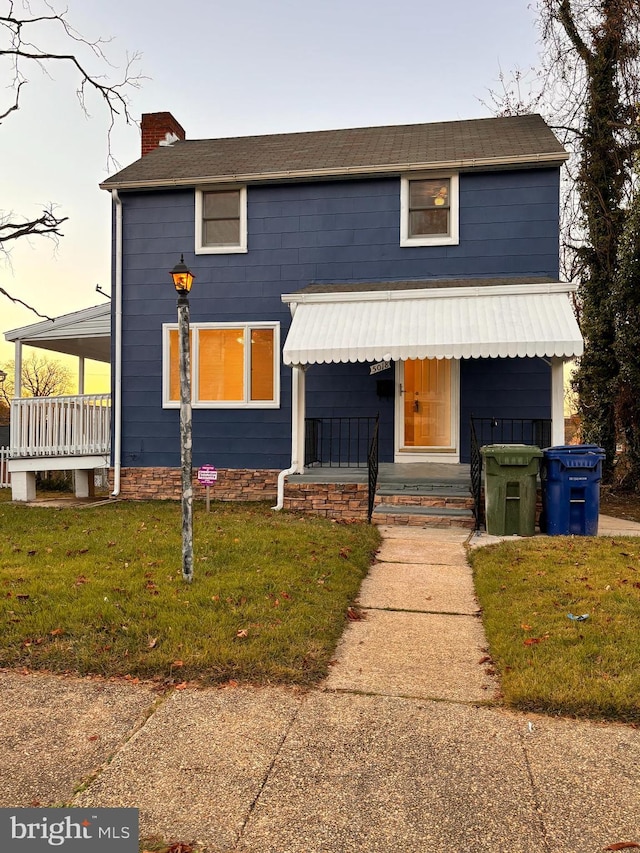 view of front of house with a lawn