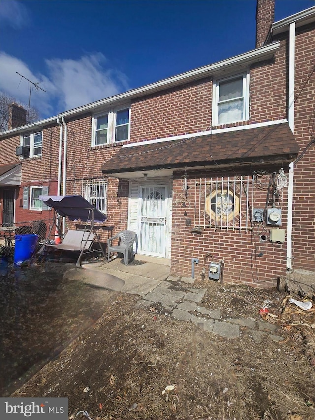 rear view of property with a patio