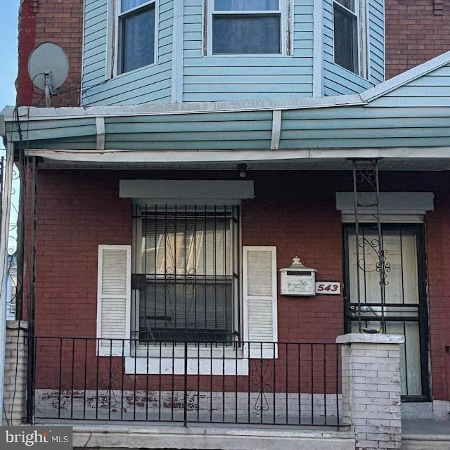 exterior space with brick siding