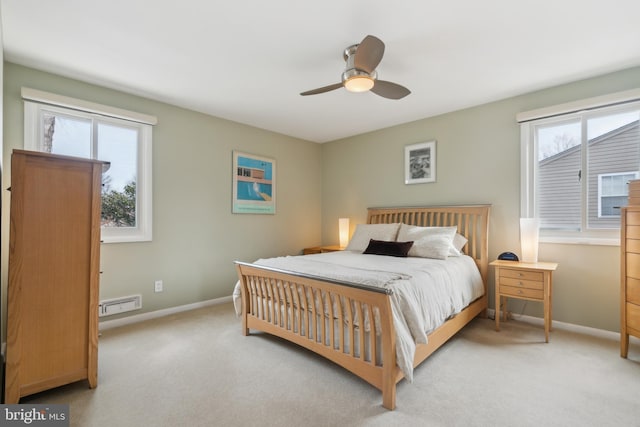 bedroom with multiple windows, light carpet, and ceiling fan