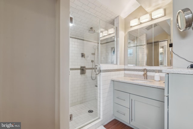 bathroom featuring vanity and walk in shower