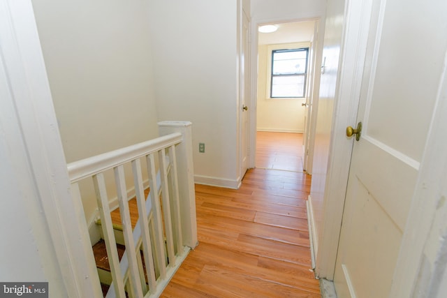 hall with light wood-type flooring