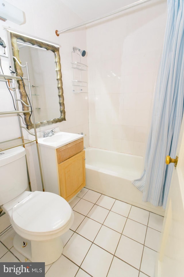 full bathroom with shower / bathtub combination with curtain, vanity, tile patterned floors, and toilet