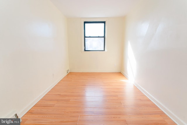 spare room featuring light hardwood / wood-style floors