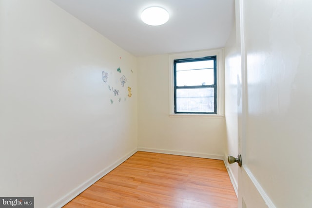 empty room with light hardwood / wood-style floors