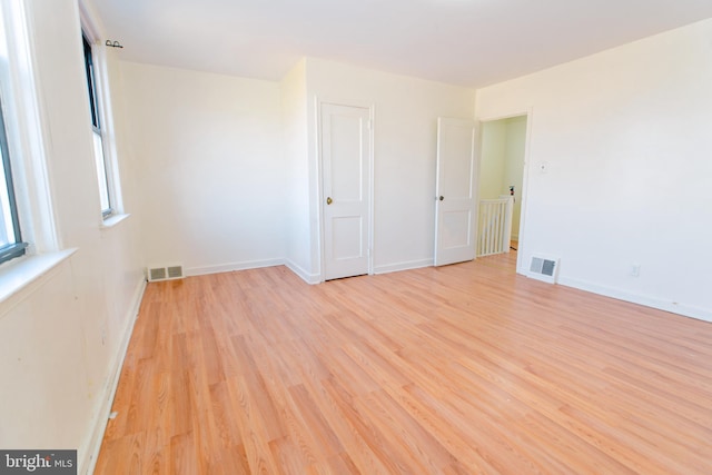 unfurnished room with light hardwood / wood-style flooring