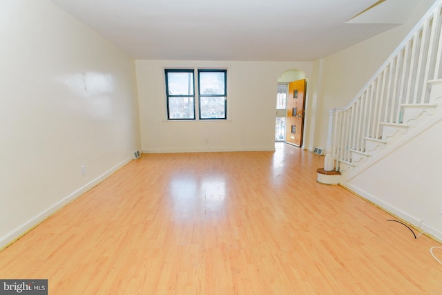 spare room featuring wood-type flooring