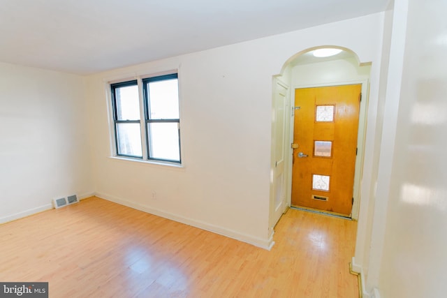 foyer entrance with light hardwood / wood-style floors