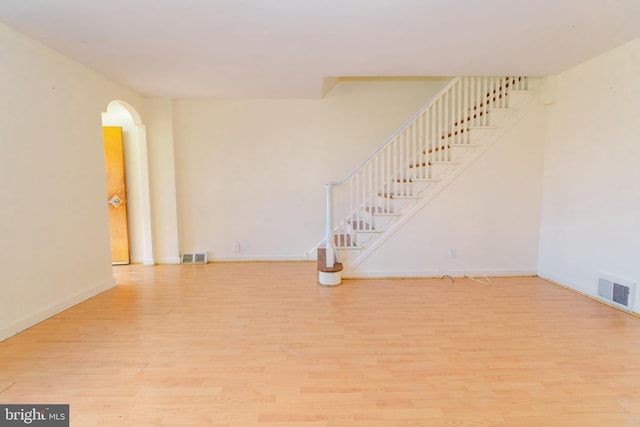 empty room with light hardwood / wood-style flooring