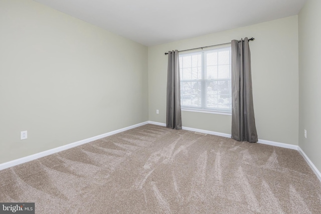 empty room featuring carpet floors