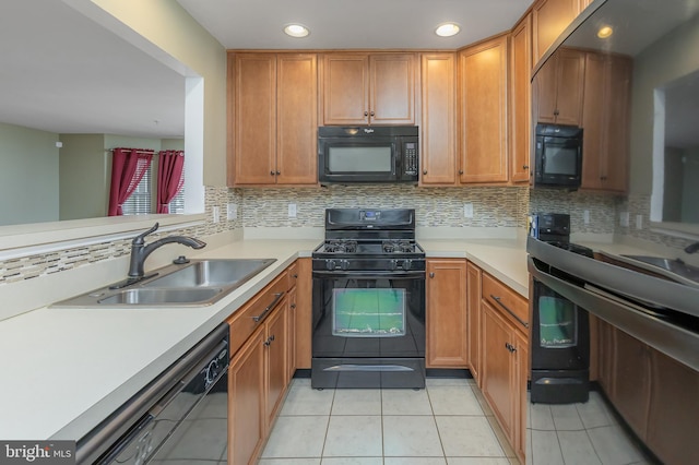 kitchen featuring sink, backsplash, black appliances, and light tile patterned flooring