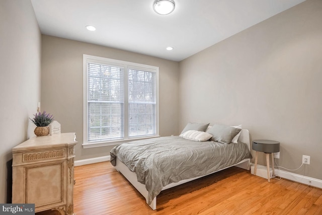 bedroom with light wood-type flooring