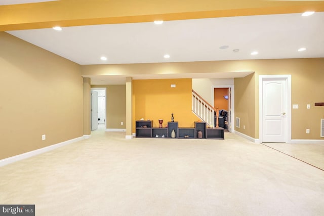 basement featuring light colored carpet