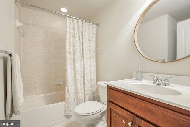 full bathroom with vanity, shower / bath combination with curtain, and toilet