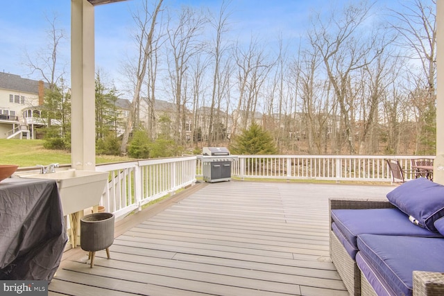 deck featuring a mountain view and area for grilling