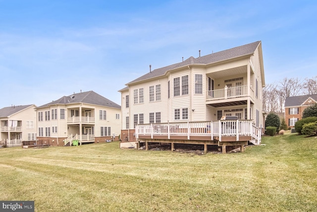 back of house featuring a yard and a deck