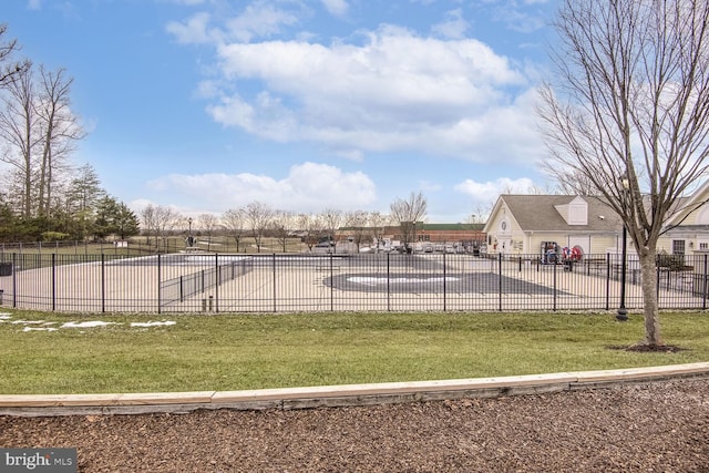 exterior space featuring a swimming pool and a lawn