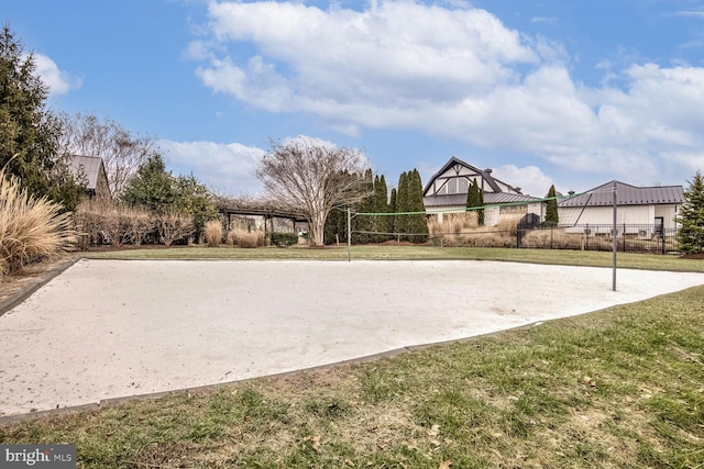 view of property's community with a yard