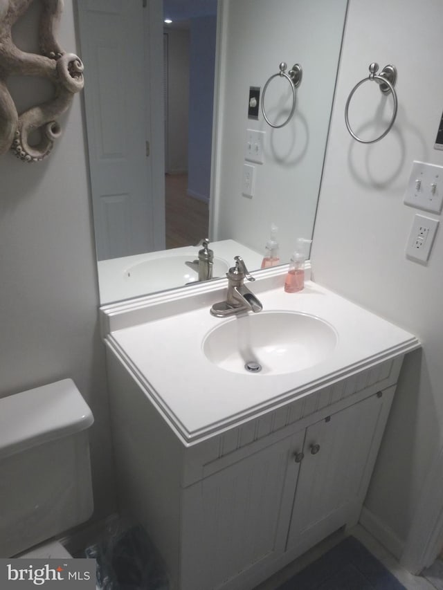 bathroom with vanity and toilet