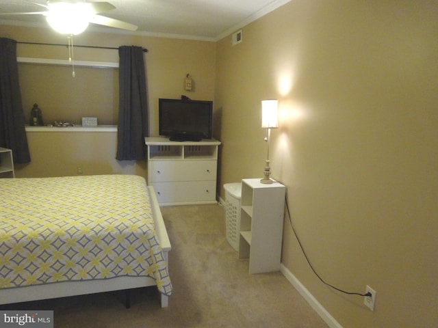 bedroom featuring crown molding and carpet