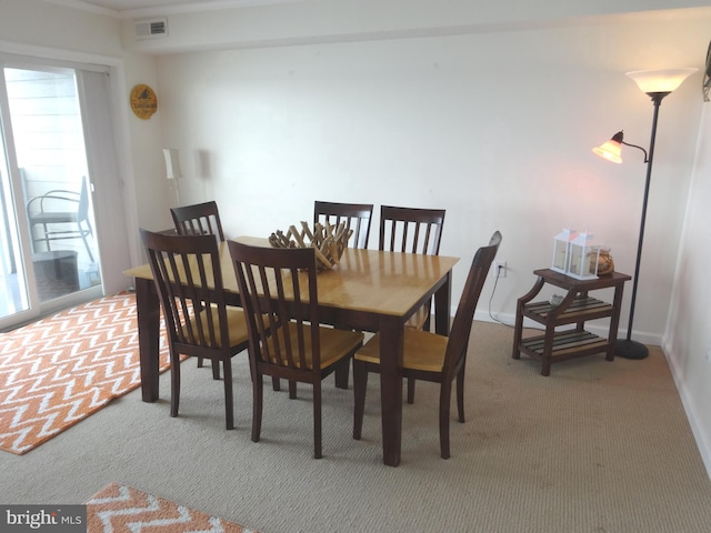 view of carpeted dining area