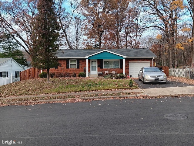 ranch-style house featuring a garage