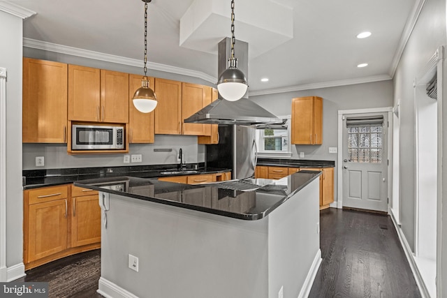 kitchen featuring dark wood-type flooring, pendant lighting, a sink, stainless steel appliances, and crown molding