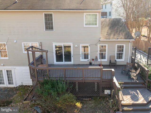 back of house with a wooden deck