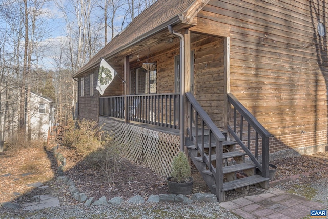 view of side of home featuring a porch