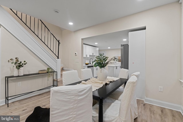 dining space featuring light hardwood / wood-style floors